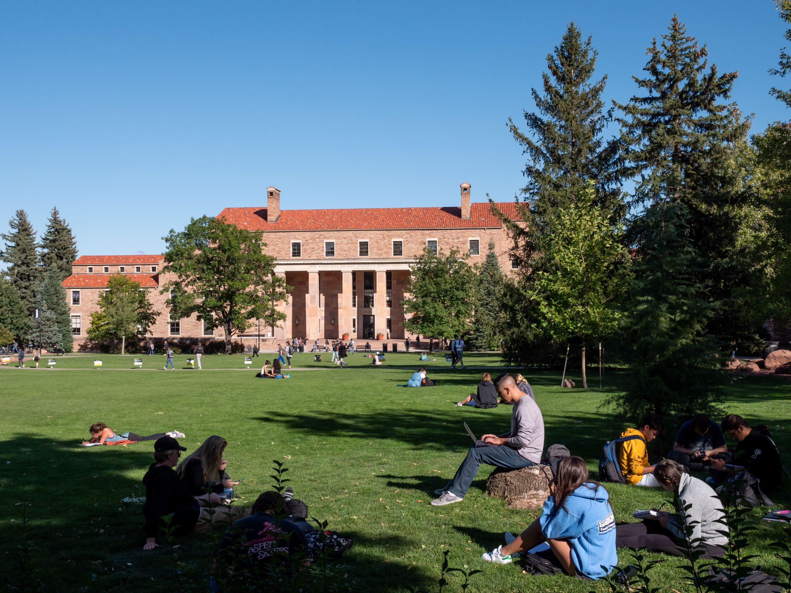 University of Colorado students relax on a pleasant day on the Boulder campus.